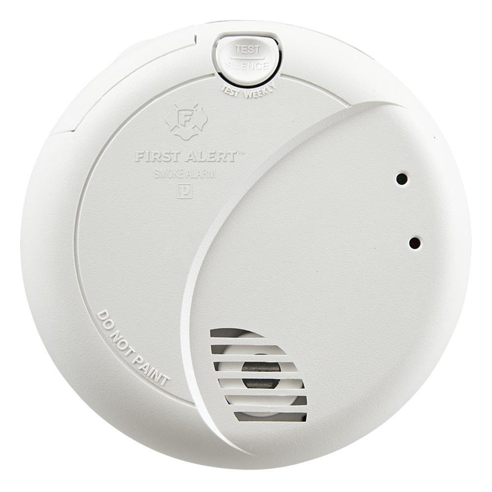 What causes an electric smoke detector to beep?